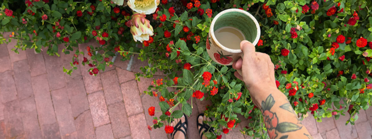 Michele Allen holding a cup