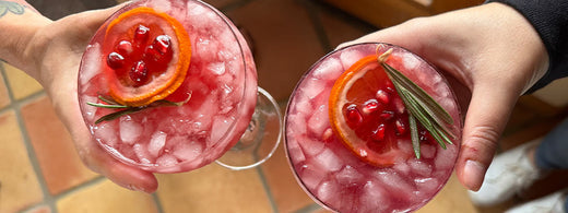 Two people holding drinks