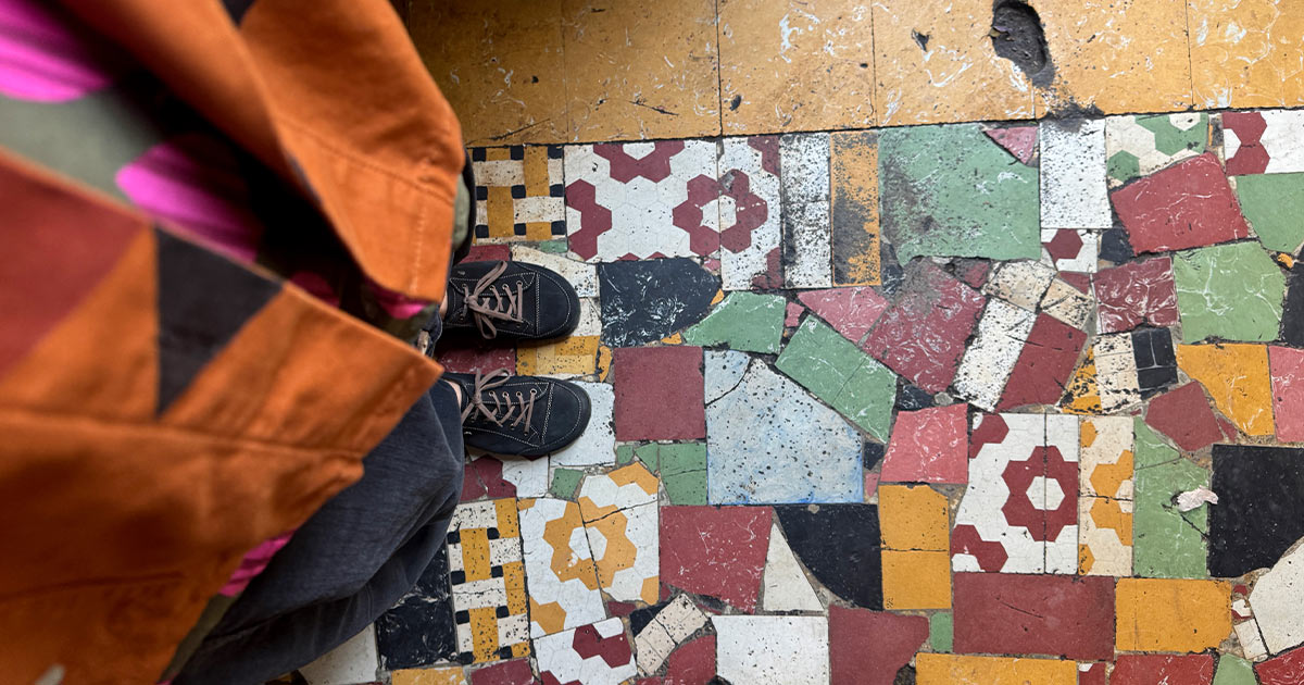 Shoes showing on a patterned floor