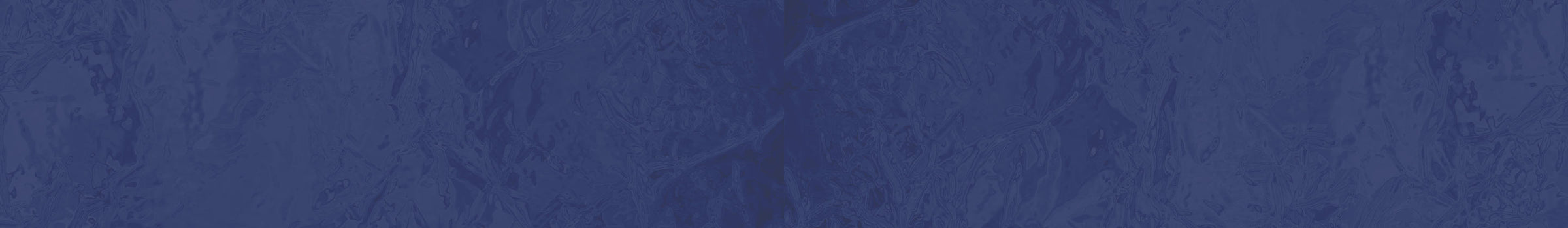 A close-up of a dark blue textured material with a subtle mottled pattern.