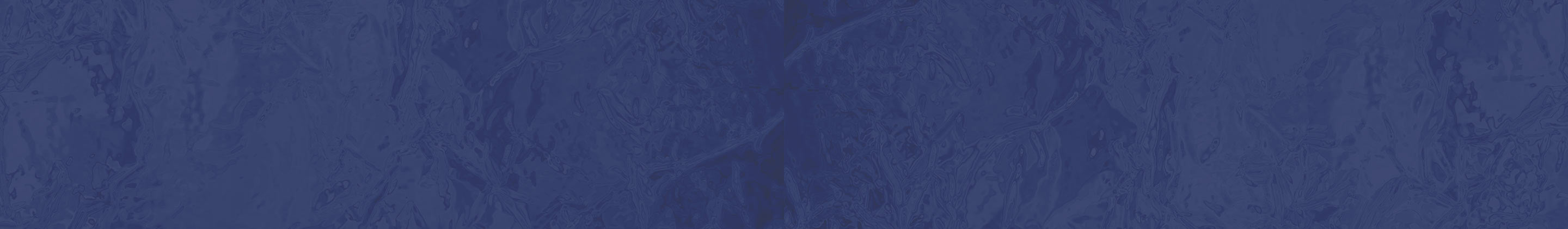 A close-up of a dark blue textured material with a subtle mottled pattern.
